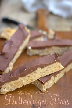 chocolate and peanut butter bars on a cutting board