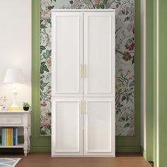 a white wardrobe with floral wallpaper in a green and white room, next to a lamp