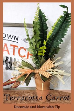 a potted plant sitting on top of a table next to a sign that says terracotta carrot decorate and more with tip