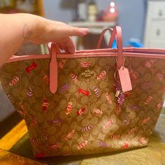 Excellent Condition. No Flaws I Can See. Brown Coach Bag With Candies. Throwing In A Candy Keychain. 17.5in W X 13in H X 6in Depth. Coach Bags Perfect As Gifts, Coach Bags Perfect For Gifts, Coach Bag For Gift, Pink Coated Canvas Bag With Removable Pouch, Pink Coach Bag As Gift, Pink Coated Canvas Bag For Everyday Use, Everyday Use Pink Coated Canvas Bag, Pink Bag With Detachable Handle In Coated Canvas, Pink Coated Canvas Bag With Detachable Handle