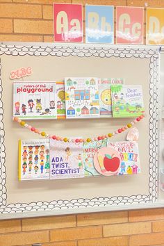 a bulletin board with books on it and magnets attached to the back of it