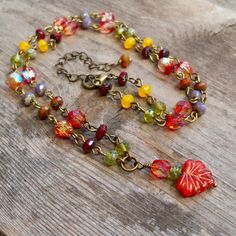 "This fun Boho-inspired necklace brings the warm colors of Autumn to any season. These gorgeous colors should not be limited to just one season a year. For those who look best in Fall and Spring colors, this necklace is for you! The slight differences in the leaf beads make this necklace a naturally unique feel. The larger leaf bead is 10 x 13mm; the smaller beads are 6mm and 3 x 5mm. All items in this series are shown in antique brass but can be made in gunmetal or silver. This necklace is 16 - Autumn Leaf Necklace, Leaf Beads Necklace, Bohemian Jewelry Diy, Czech Beads Jewelry, Fall Necklace, Boho Necklaces, Autumn Jewelry, Colors Of Autumn, Leaf Beads