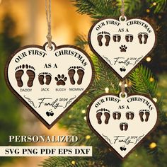 personalized christmas ornament with feet and footprints hanging from a tree in the shape of a heart