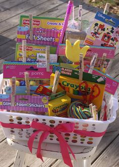 a white basket filled with lots of toys