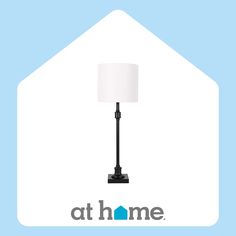 a lamp that is sitting on top of a blue background with the words at home above it