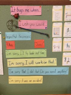 a bulletin board with writing on it and magnets attached to the back of it