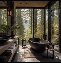 a large bath tub sitting in the middle of a bathroom next to a sink and window