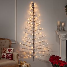 a living room with a christmas tree in the corner