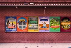 a red brick building with posters on the side of it's front door and windows