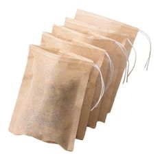 four bags are lined up and ready to be used as gifts or food wrappers