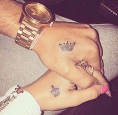 two people with matching tattoos on their hands