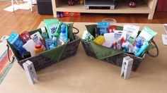 two baskets filled with personal care products on top of a rug