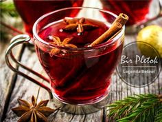 two glasses of mulled tea with cinnamon and star anise