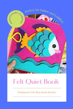 the felt quiet book is open to reveal an image of a fish on it's side