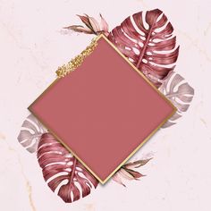 a pink square with gold frame surrounded by tropical leaves on a marble background that looks like it could be used as a greeting card