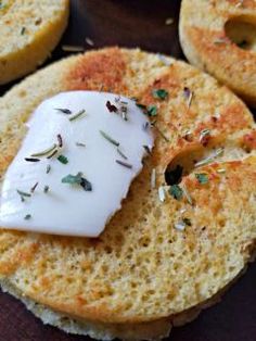 some bread with cheese and herbs on it