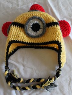 a crocheted hat with an eye on it