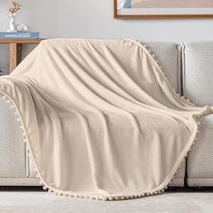 a couch with a blanket on top of it