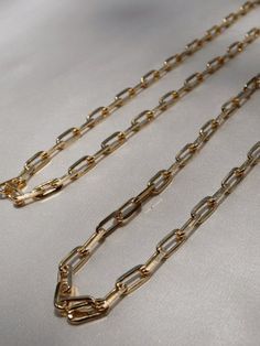 Rectangle Chain Link Necklace | Link Chain Choker | 18k Gold Filled Necklace | Medium Thick Link Chain Timeless, light & comfortable gold jewelry to wear all day, every day. Stunning piece to wear with layers, charms, or even by itself! Premium quality 18k Gold Filled Materials: Gold on Brass Measurements: Width 5mm - 16 inches long - 18 inches long Nickel & Lead Free Hypoallergenic Gold Link Chain Necklace, Gold Link Chain, Gold Filled Necklace, Link Chain Necklace, Chain Choker, Chain Link Necklace, Link Necklace, Link Chain, Chain Link