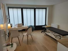 a living room filled with furniture and a large window