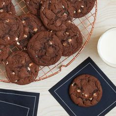 chocolate cookies and milk on a table