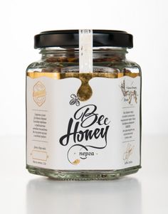 a jar filled with honey sitting on top of a table