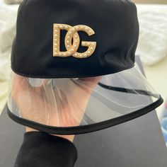 Dolce & Gabbana Black Transparent Brim Bucket Hat With Gold And Petal Dg Logo. Size 57. Worn Once Like New. Box And Dust Bag Included. Dg Logo, Bucket Hat Black, Bucket Hat, Dolce And Gabbana, Dust Bag, Cover Up, Summer Fashion, Like New, Women Accessories