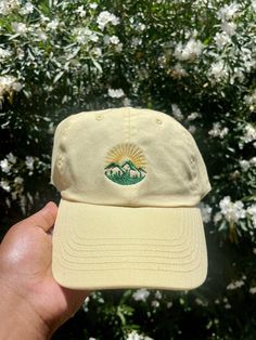 This Sunset Adventure Mountain Embroidered Dad cap / Baseball hat is perfect to show off your love for nature! This hat is perfect for hiking days as well as being fashionable. Our hats are not gender specific, therefore anyone's to enjoy these caps! Specs: - 100% bio-washed chino twill - Unstructured, six-panel, low-profile - Pre-curved visor - Self-fabric tri-glide buckle closure *Processing time is 1-3 Weeks. Most Orders are processed within the first week, the extra weeks allow for mechanica Cheap Embroidered Snapback Baseball Cap, Affordable Embroidered Baseball Cap, Embroidery On Hats Baseball Caps, Casual Embroidered Hats For Outdoor, Cotton Visor Hat For Outdoor Activities, Outdoor Embroidered Trucker Baseball Cap, Embroidered Adjustable Trucker Hat For Outdoor, Embroidered Trucker Hat For Outdoor, Embroidered Outdoor Baseball Cap