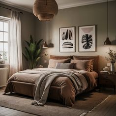 a large bed in a bedroom next to two pictures on the wall and a window