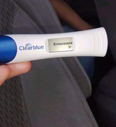 a person is holding an electronic device in their hand, with the word clearblue on it