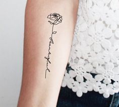 a woman's arm with a tattoo that reads, i love you and a rose on it