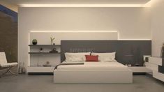 a modern bedroom with white and gray decor, including a bed that has red pillows on it