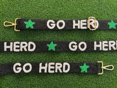 The perfect way to rep your school against opposing teams at football games or every day around campus! Our new and improved adjustable beaded bag strap has finally launched! Gently slide the buckle to customize the strap to the length of your choosing The GO HERD strap is made of black, white and green glass beads hand sewn bead by bead with an added star pattern and attached to a matching black fabric. -Beaded Strap has a width of 1 1/2 inches.  -At full length the bag strap is 4 feet long wit University Bag, Marshall University, Beaded Strap, Favorite Handbags, Beaded Bag, Purse Strap, Star Pattern, Hook Clasp, Football Games