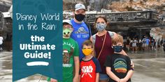 a group of people wearing face masks standing in front of a sign that says disney world in the rain