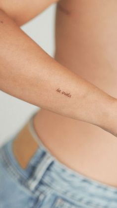 a person with a small tattoo on their arm