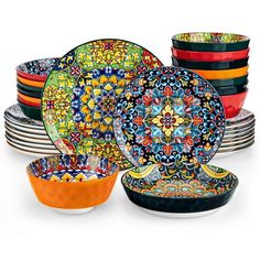 colorful plates and bowls are stacked on top of each other