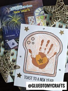 two children's handprints on top of each other with fireworks in the background