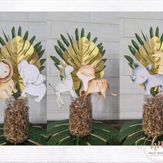 three vases filled with fake animals on top of grass and straw in front of a white brick wall