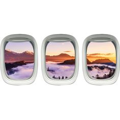 the view from inside an airplane window shows mountains and clouds in the distance, as well as fog