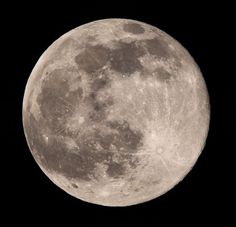 the full moon is seen in the dark sky