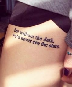 a woman's leg with a tattoo saying, but without the dark we'd never see the stars