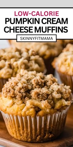 low - calorie pumpkin cream cheese muffins on a wooden cutting board