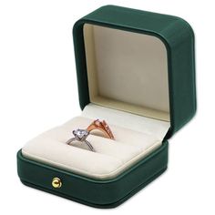 an open box with a ring in it