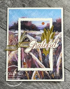 a card with the words grateful on it and an image of a wheat field in the background