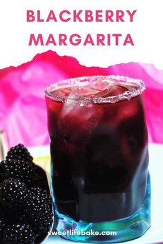 a blackberry margarita with blackberries on the side