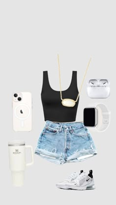 a black top, shorts and sneakers are arranged in the shape of a woman's body