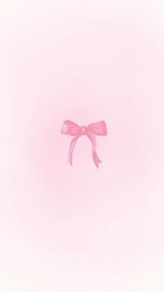 a pink bow on a light pink background