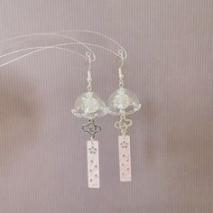 Elevate your style with these handmade earrings - an ideal blend of culture, craftsmanship, and elegance. They're perfect for any occasion!  🤍 Made with high-quality hand crafted wind chime style glass charms, adorned with glass crystal beads and resin pendants (light pink or white), they are absolutely eye catching jewelleries!  🤍Finish with silver plated nickel-free hypoallergenic earring hooks. These earrings not only look gorgeous but also prioritize comfort. 🤍Size: - Approx. 8cm in lengt Windchime Earrings, White Sterling Silver Dangle Flower Earrings, White Dangle Crystal Earrings Gift, White Sterling Silver Flower Earrings For Party, Elegant Clear Earrings As Gift, Sterling Silver Dangle Flower Earrings For Gifts, Clear Flower Drop Earrings Gift, Clear Flower Drop Earrings For Gifts, Handmade Clear Drop Earrings