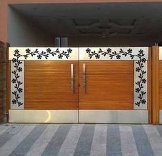 two wooden doors with flowers painted on them