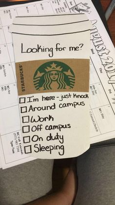 someone is holding up their starbucks coffee ticket